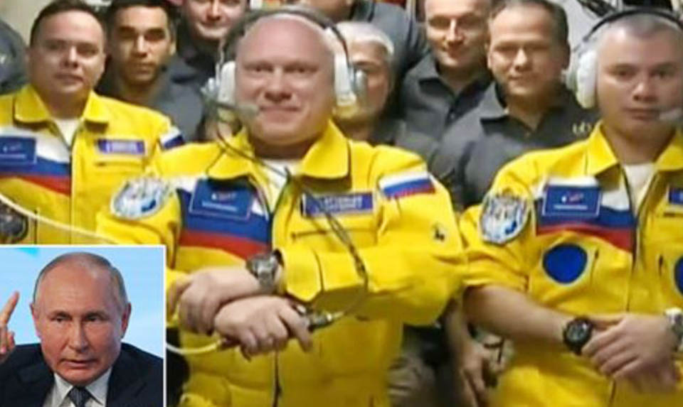 Russian cosmonauts wearing Ukraine colors